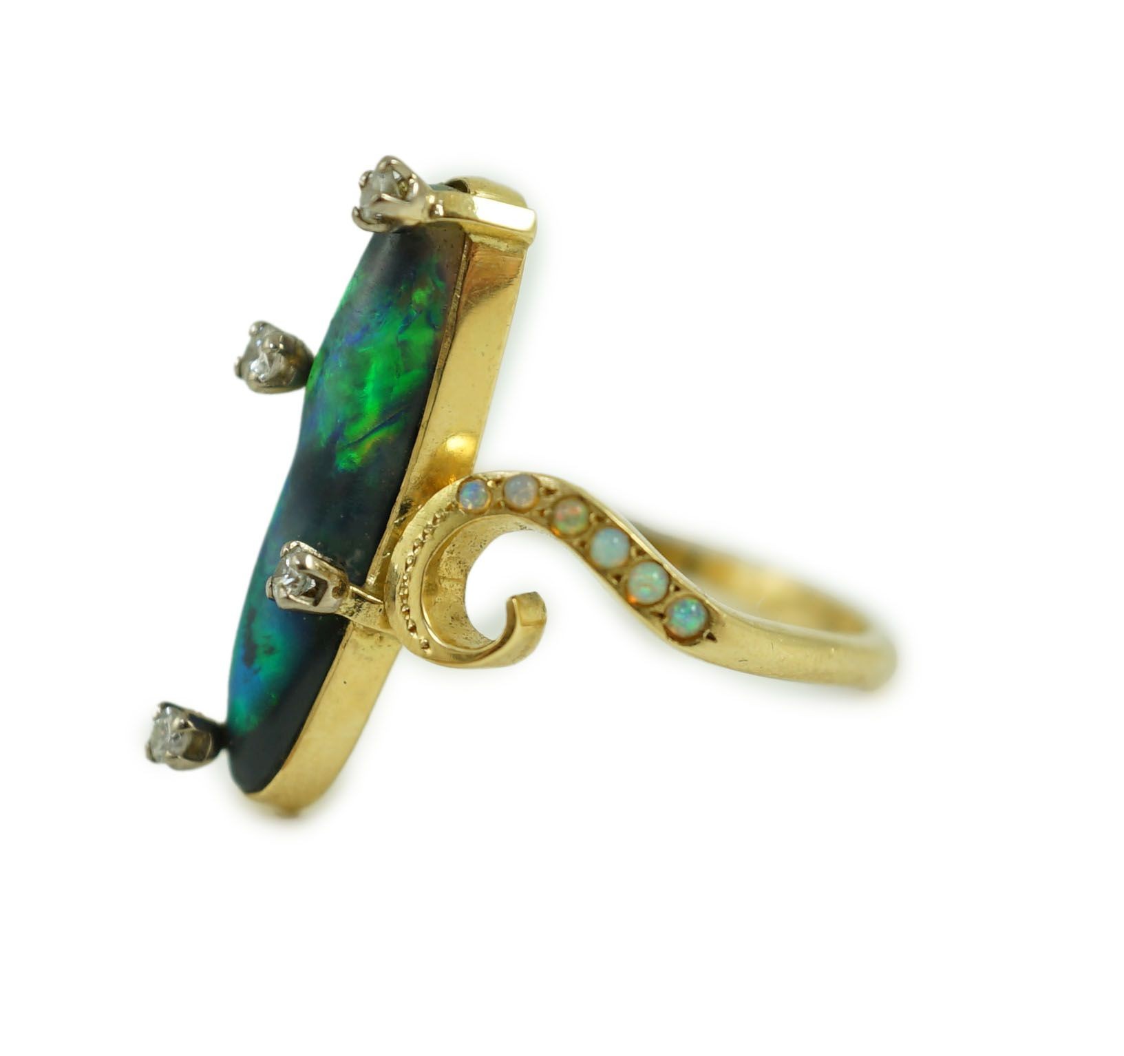 A stylish early to mid 20th century 18ct gold, black opal and diamond chip set dress ring